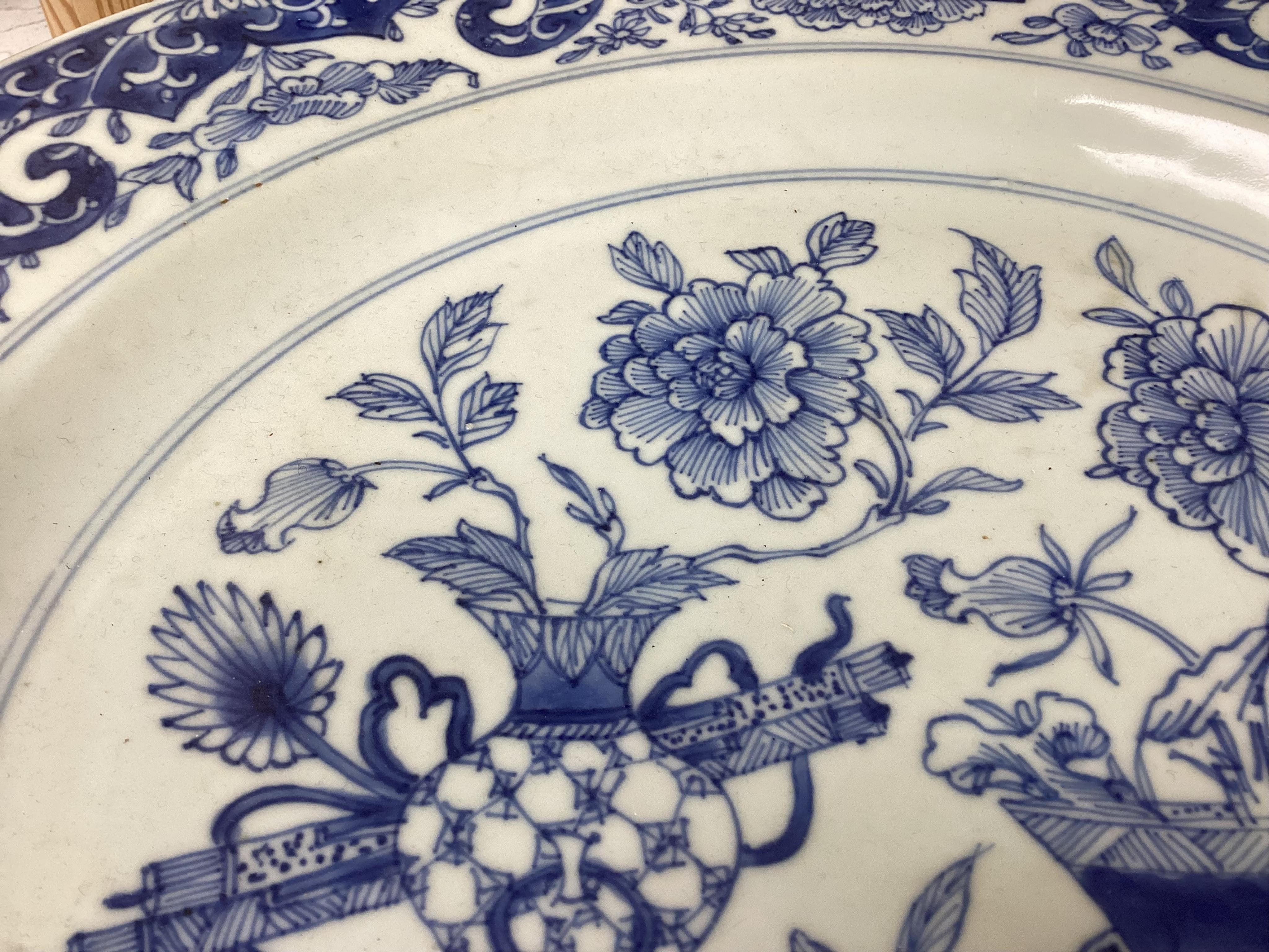 A Worcester teapot, c.1770, an 18th century Chinese famille rose and a blue and white dish, a small blue and white dish, a cup and saucer and teapot, largest dish 39cm (7). Condition - most damaged, cracked or chipped